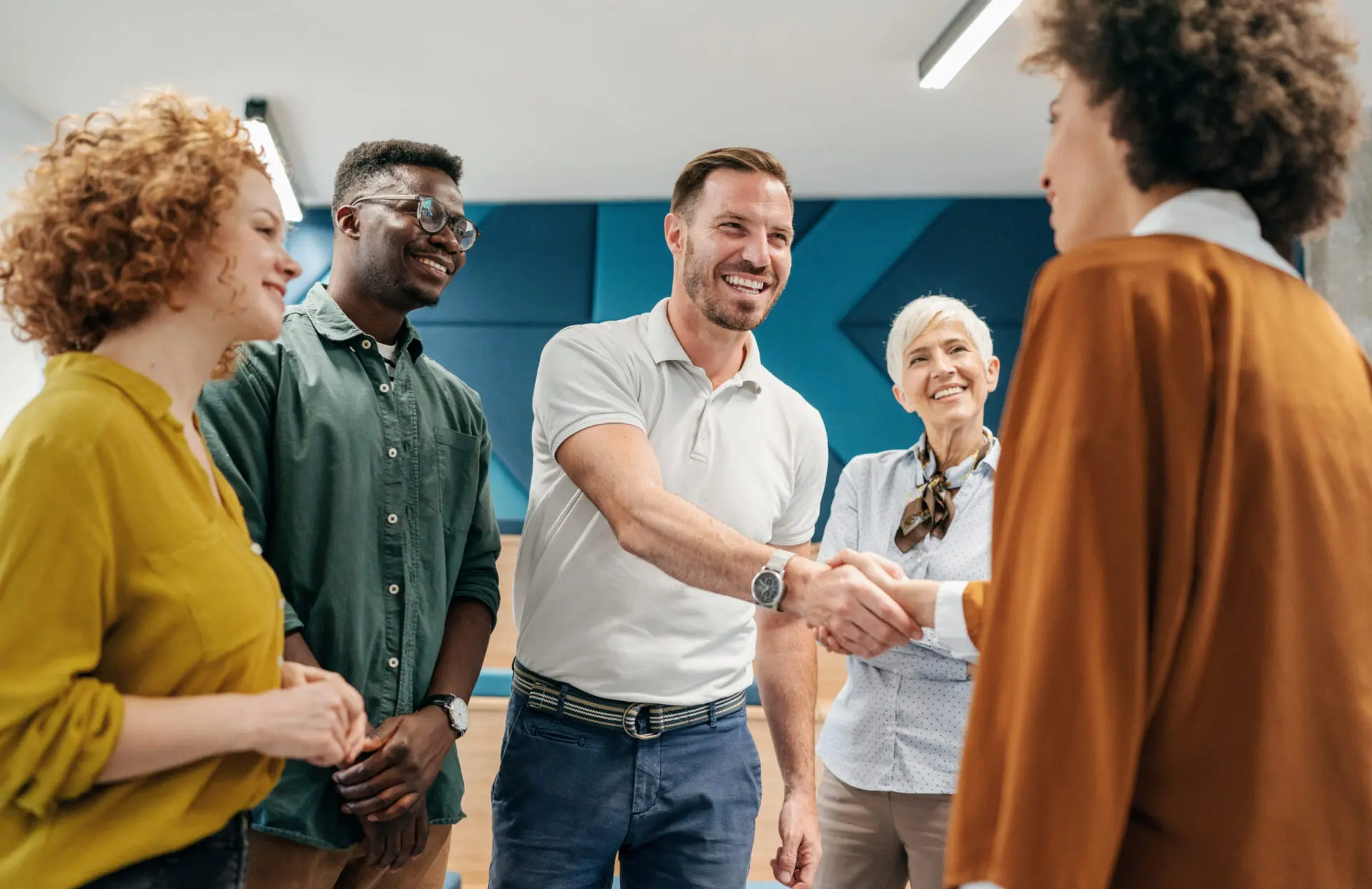 Group of people shaking hands