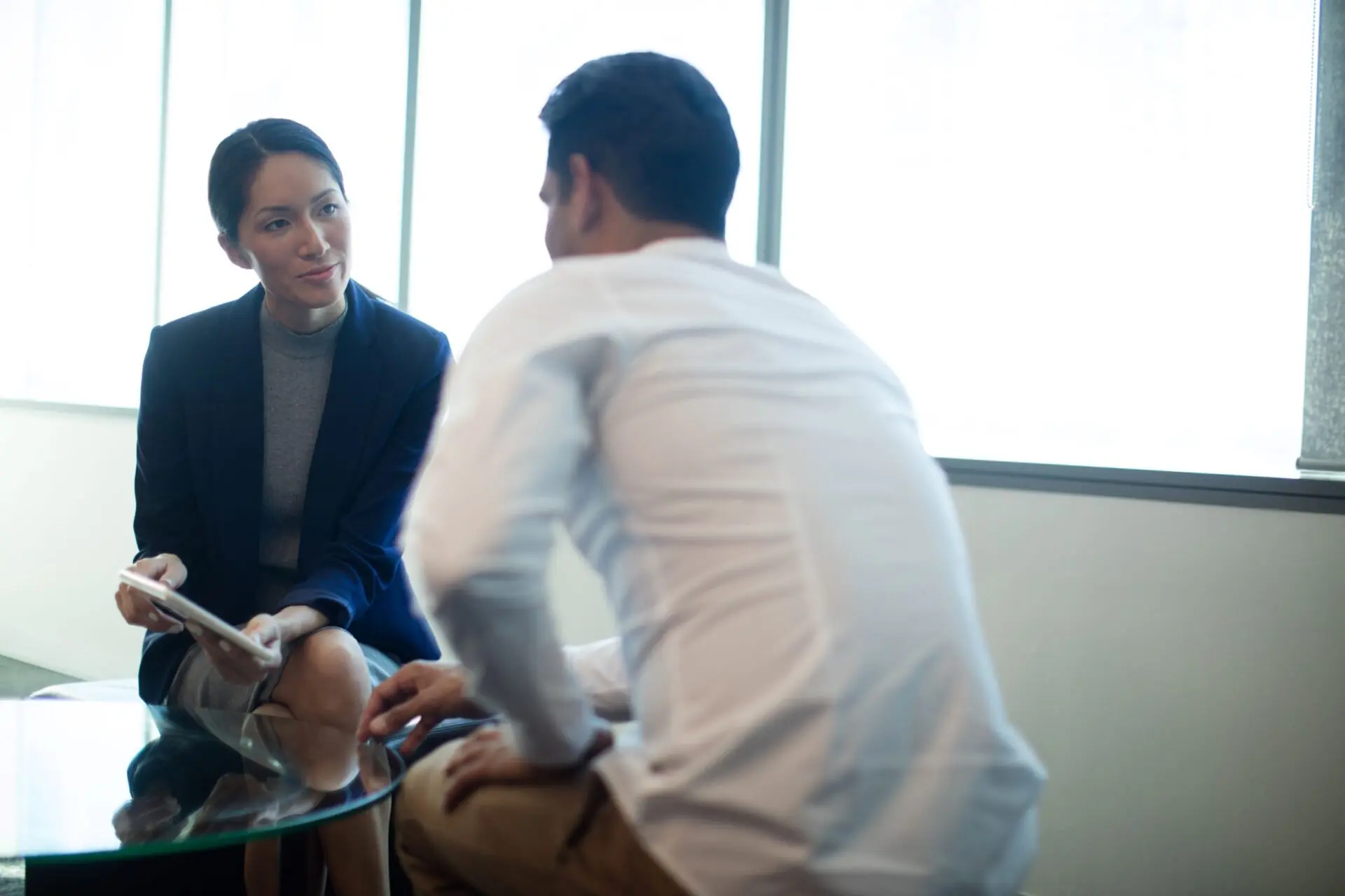 man and woman in a meeting
