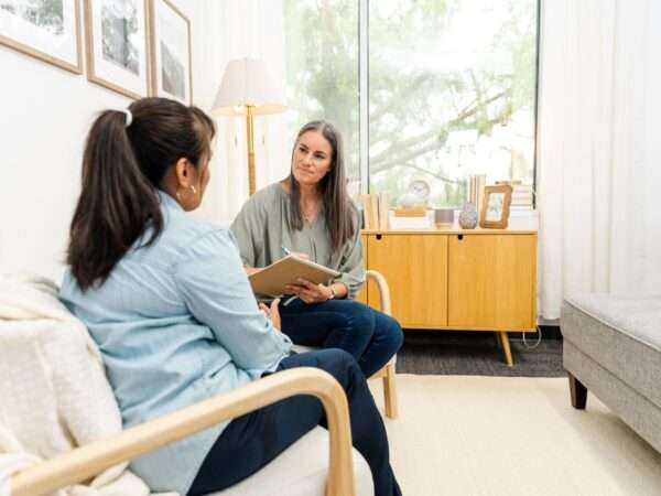 woman talking to female counselor