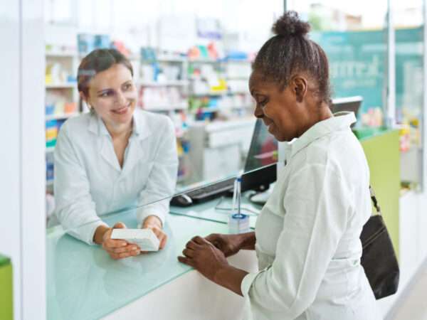 female pharmacist with customer
