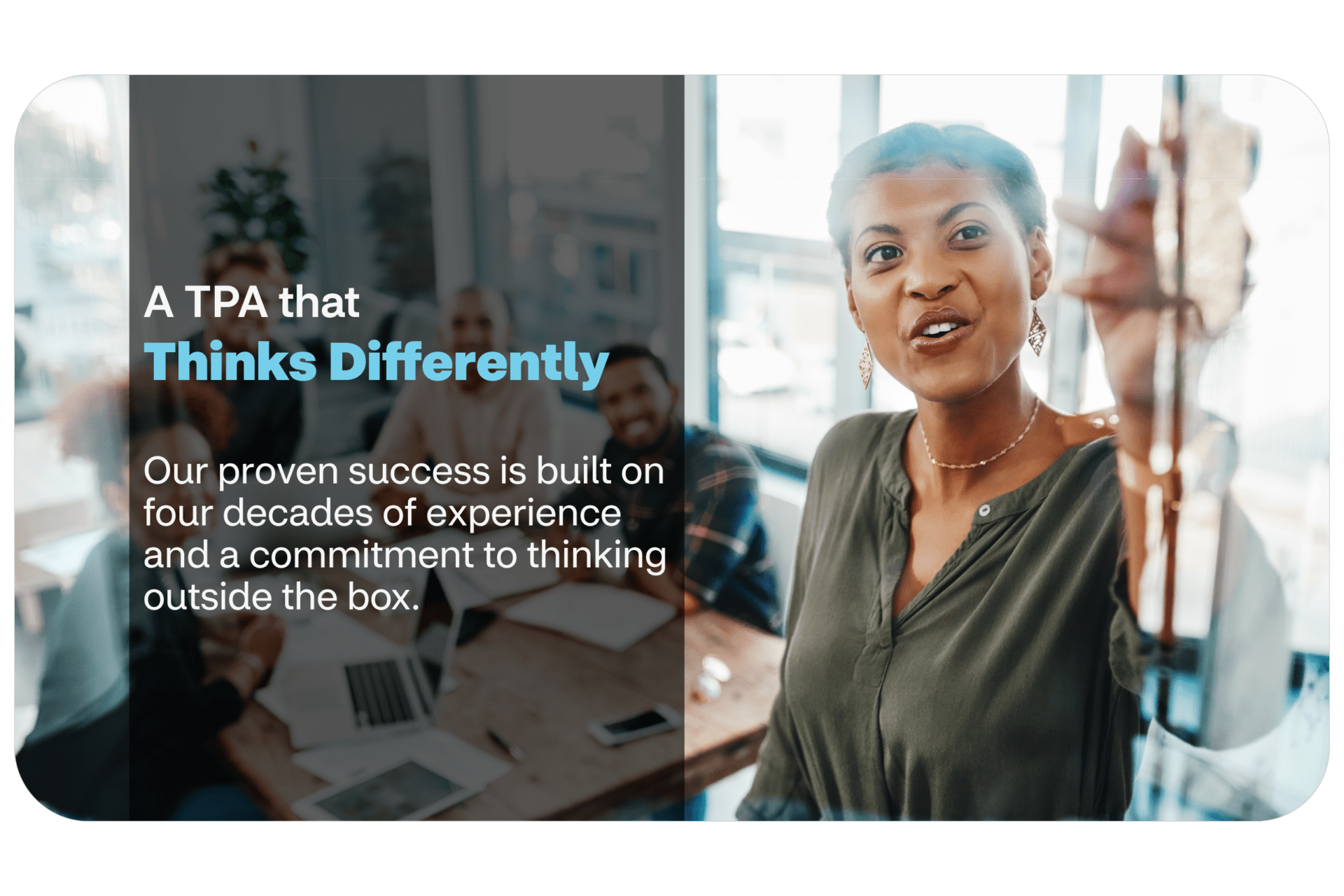 Woman pointing at whiteboard in conference room of people
