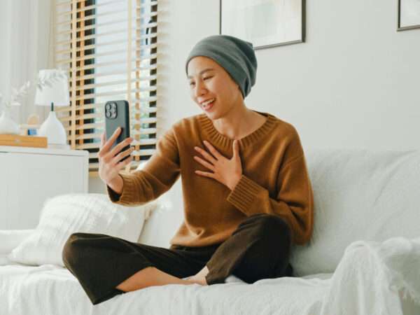cancer patient holding phone