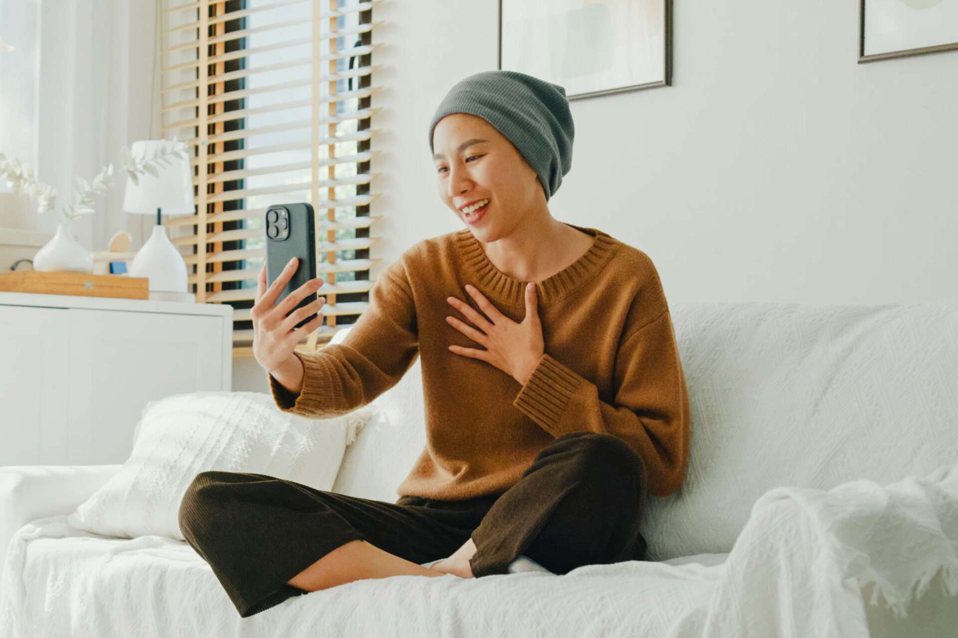 cancer patient holding phone