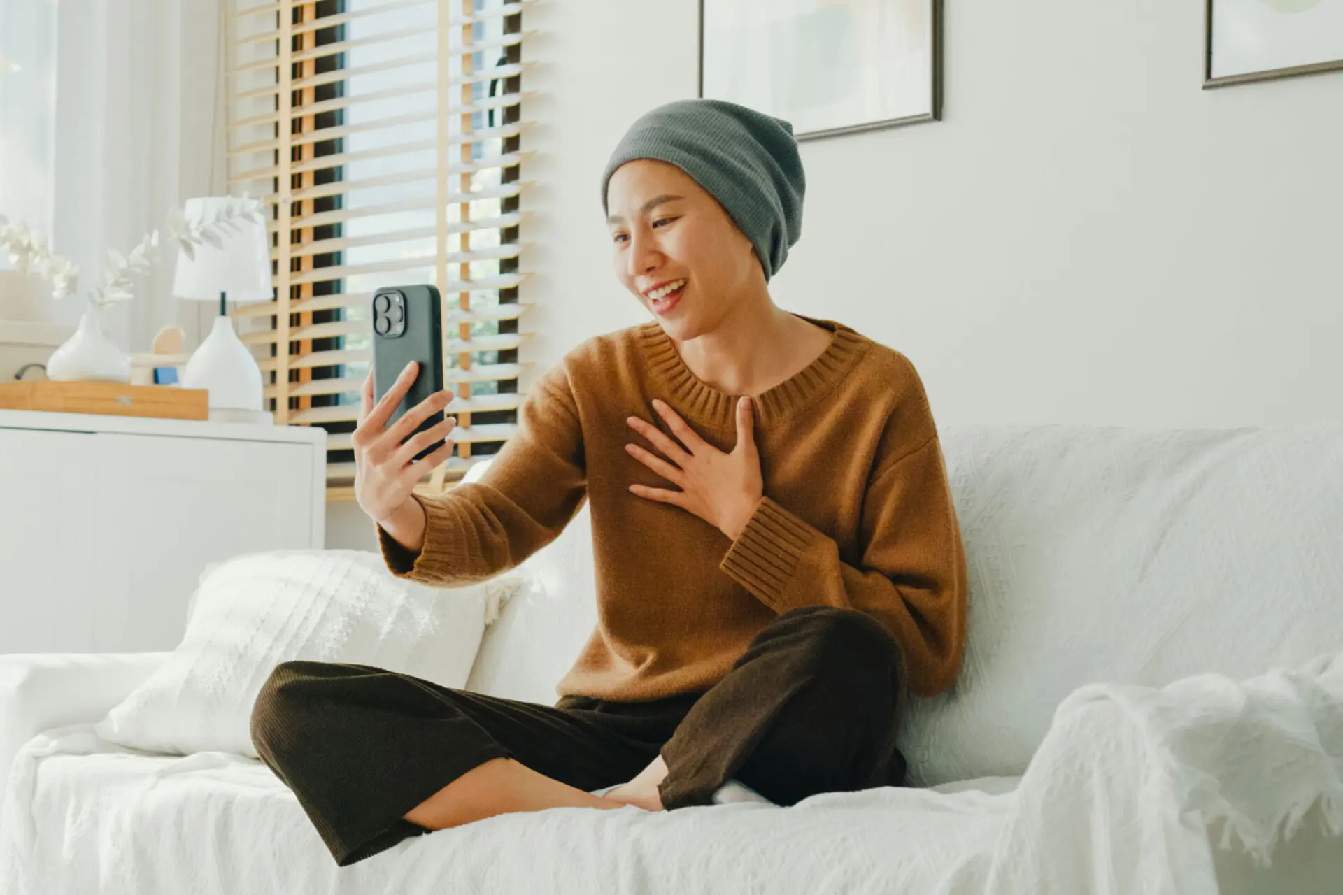 cancer patient holding phone