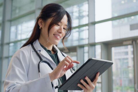 Doctor using tablet in hospital
