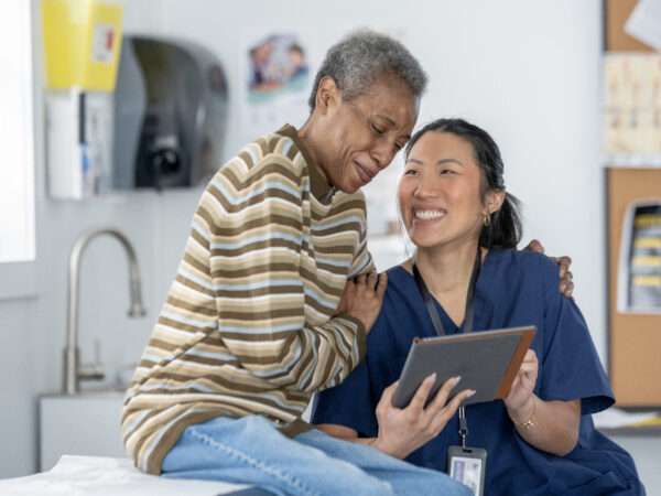 Doctor comforting a patient